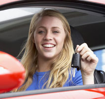 Smiling girl with car keys